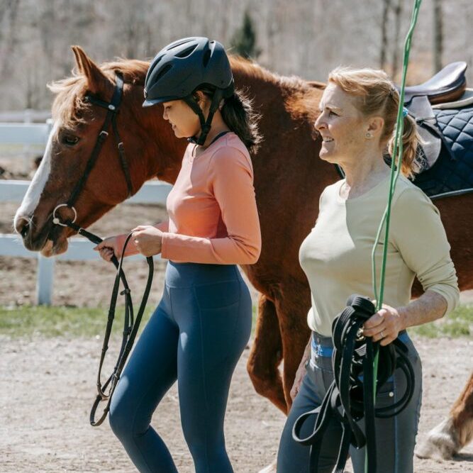 Teacher and student in horse therapy certification program